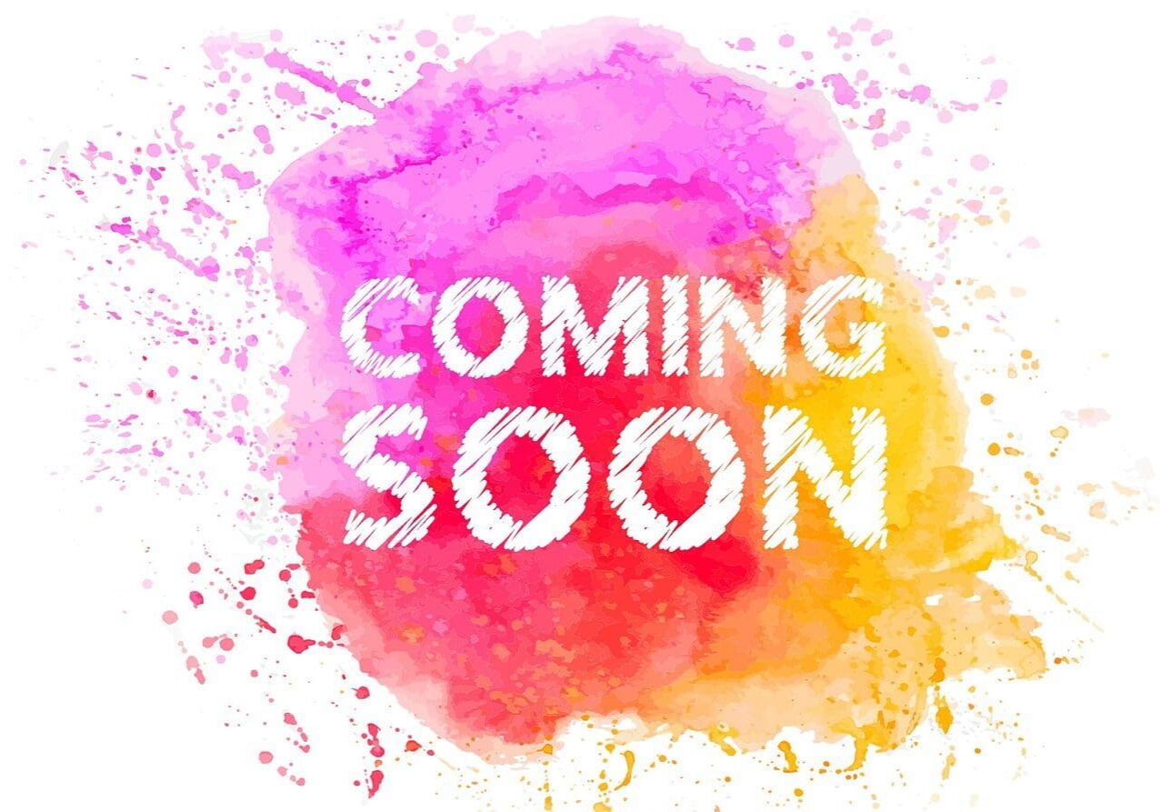 Text "COMING SOON" written in white over a colorful watercolor splatter background.